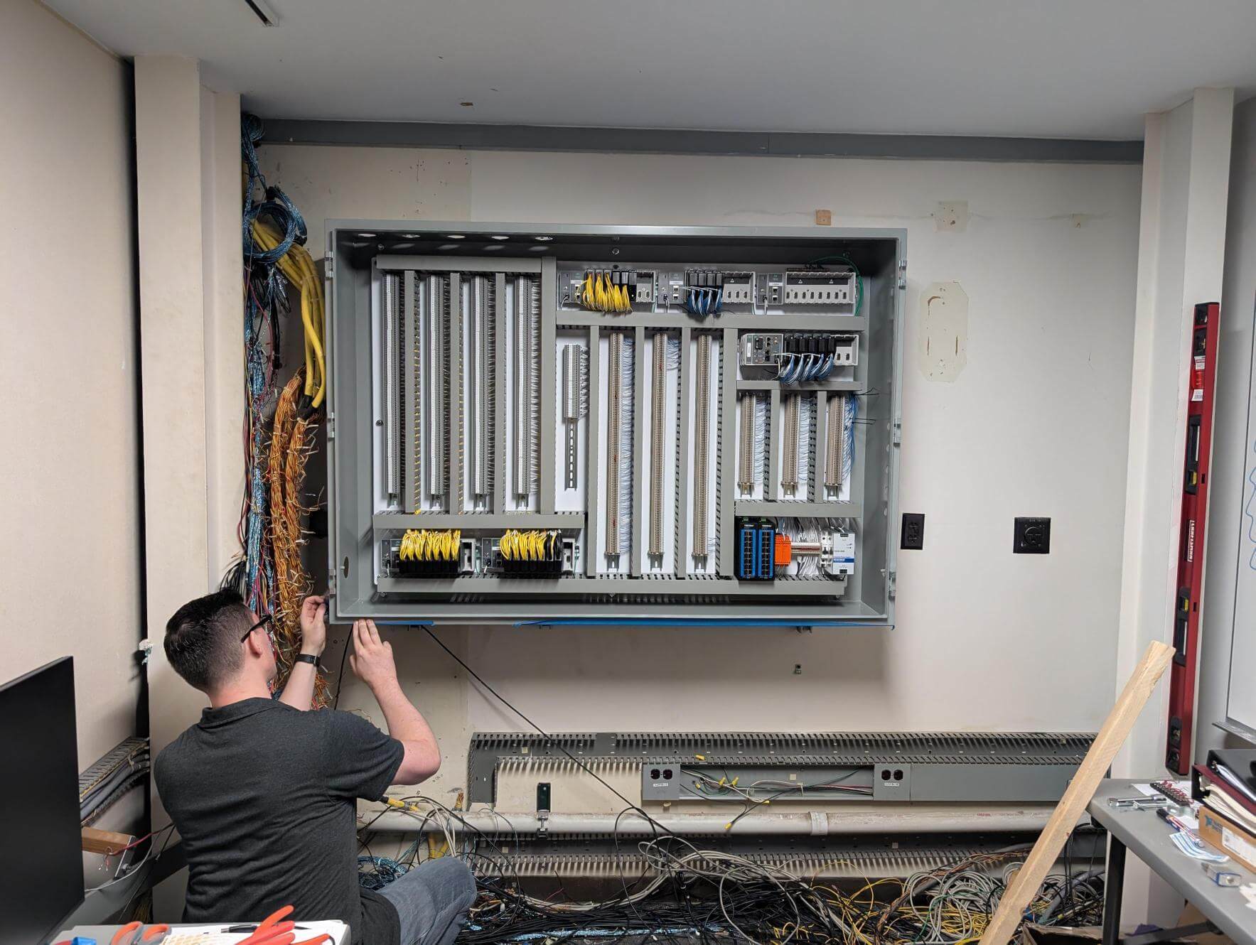 New control panel mounted to the wall ready to have the thermocouple wire fed through the top and wired to pre-labeled terminals.